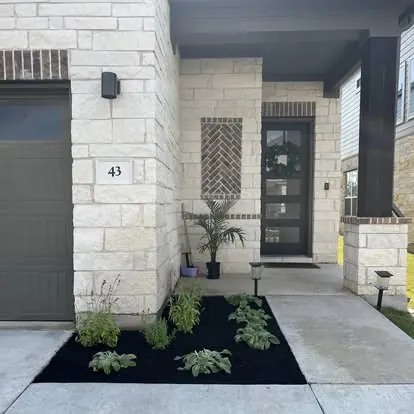 Fresh mulch bed at a home entry